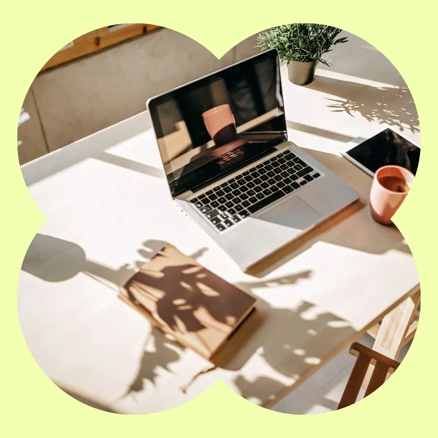 A laptop on a sunny desk